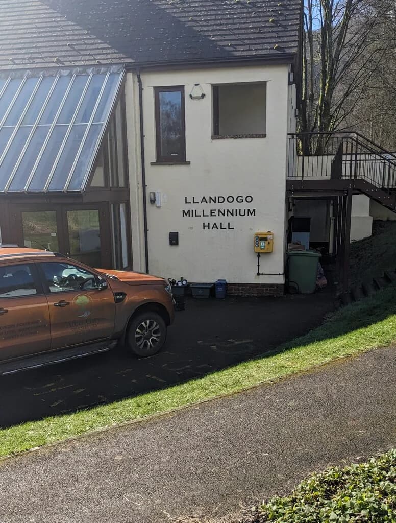 Llandogo Village Hall: Yellow box on the wall of Llandogo Millennium Hall